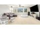 Spacious living room with comfortable seating, large TV, and pet bed at 3702 W Riordan Ranch Rd, Phoenix, AZ 85083