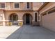 Front entrance with arched entryway, double doors and a security door at 3702 W Riordan Ranch Rd, Phoenix, AZ 85083
