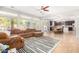 Open living room and kitchen with a large sectional sofa at 3702 W Riordan Ranch Rd, Phoenix, AZ 85083