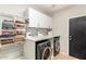 Laundry room with washer, dryer, and convenient storage at 3702 W Riordan Ranch Rd, Phoenix, AZ 85083