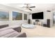 Spacious Gathering room featuring a large TV, comfortable seating, and ample natural light at 3702 W Riordan Ranch Rd, Phoenix, AZ 85083