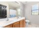 Clean bathroom with double vanity, shower/tub combo, and window at 3702 W Riordan Ranch Rd, Phoenix, AZ 85083