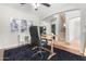 Home office with a desk, chair, and built-in shelving at 3702 W Riordan Ranch Rd, Phoenix, AZ 85083