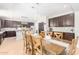 Eat-in kitchen with dark cabinetry, an island, and tile flooring at 3702 W Riordan Ranch Rd, Phoenix, AZ 85083
