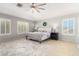 Large main bedroom with carpeted floor, plantation shutters, and ceiling fan at 3702 W Riordan Ranch Rd, Phoenix, AZ 85083