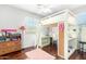 Bedroom with built-in loft bed, desk, and ample storage solutions at 3702 W Riordan Ranch Rd, Phoenix, AZ 85083