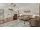 Light and airy living room with hardwood floors, leather chairs, and a wood coffee table at 12909 W Meeker Blvd, Sun City West, AZ 85375