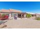 Large backyard with gravel, covered patio and mature plants at 12909 W Meeker Blvd, Sun City West, AZ 85375