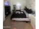 Spacious bedroom with king-size bed and shelving at 2450 W Glenrosa Ave # 12, Phoenix, AZ 85015