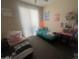 Bedroom with two twin beds and playful decor at 2450 W Glenrosa Ave # 28, Phoenix, AZ 85015
