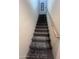 Carpeted staircase with wooden handrail at 2450 W Glenrosa Ave # 28, Phoenix, AZ 85015