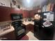 Kitchen features dark wood cabinets and black appliances at 2450 W Glenrosa Ave # 28, Phoenix, AZ 85015