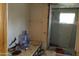 Small bathroom with shower and tub, needing renovation at 65 S Mountain Rd, Apache Junction, AZ 85120