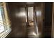 A long narrow hallway with wood paneling and minimal features at 65 S Mountain Rd, Apache Junction, AZ 85120