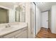 Bathroom with vanity, closet, and wood floors at 7632 E Bonita Dr, Scottsdale, AZ 85250