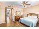 Bright bedroom with a ceiling fan and wood-look floors at 526 E Viola St, Casa Grande, AZ 85122