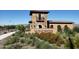Photo depicts the community entrance with signage and landscaping at 19366 W San Juan Ave, Litchfield Park, AZ 85340