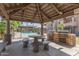 Outdoor kitchen and dining area with built-in grills at 5995 N 78Th St # 1108, Scottsdale, AZ 85250