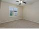 Bright bedroom with ceiling fan and neutral carpeting at 5995 N 78Th St # 1108, Scottsdale, AZ 85250
