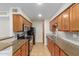 Updated kitchen featuring granite countertops and wood cabinets at 5995 N 78Th St # 1108, Scottsdale, AZ 85250