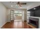 Living room with fireplace, hardwood floors and patio access at 5995 N 78Th St # 1108, Scottsdale, AZ 85250