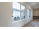 Bright hallway with view of a private courtyard through large windows at 24282 S 219Th St, Queen Creek, AZ 85142