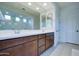 Elegant bathroom with double sinks, large mirror, and a walk-in shower at 1957 W Fawn Way, San Tan Valley, AZ 85144