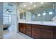 Spacious bathroom with double sinks, a shower, and views into the bedroom at 1957 W Fawn Way, San Tan Valley, AZ 85144