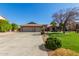 Two-story house with three-car garage and landscaped lawn at 10913 N 153Rd Ln, Surprise, AZ 85379