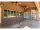 Covered patio with tile flooring and ceiling fans at 10913 N 153Rd Ln, Surprise, AZ 85379