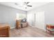 Spacious bedroom with wood-look floors and double door closet at 10913 N 153Rd Ln, Surprise, AZ 85379