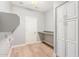 Laundry room with built-in cabinets and countertop workspace at 10913 N 153Rd Ln, Surprise, AZ 85379