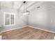 Spacious dining area with wood floors and chandelier at 10913 N 153Rd Ln, Surprise, AZ 85379