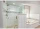 Modern bathroom with a large shower and soaking tub at 10913 N 153Rd Ln, Surprise, AZ 85379