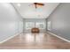 Living room with wood floors and ceiling fan at 10913 N 153Rd Ln, Surprise, AZ 85379