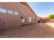 Side of house showcasing windows and a basketball hoop at 10913 N 153Rd Ln, Surprise, AZ 85379