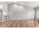 Bright living room with hardwood floors and a view to backyard at 10913 N 153Rd Ln, Surprise, AZ 85379