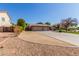 House exterior with large driveway and landscaping at 10913 N 153Rd Ln, Surprise, AZ 85379