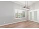Bright dining room with wood floors and view to backyard at 10913 N 153Rd Ln, Surprise, AZ 85379