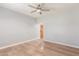 Bedroom with ceiling fan and access to hallway at 10913 N 153Rd Ln, Surprise, AZ 85379