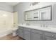 Bathroom with double vanity and updated fixtures at 10913 N 153Rd Ln, Surprise, AZ 85379