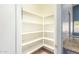 Walk-in pantry with adjustable shelving at 10913 N 153Rd Ln, Surprise, AZ 85379