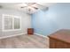 Bright bedroom with light blue accent wall and wood floors at 10913 N 153Rd Ln, Surprise, AZ 85379