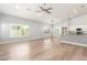 Spacious living room with wood floors and ceiling fan at 10913 N 153Rd Ln, Surprise, AZ 85379