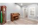 Room features hardwood floors, piano, and grandfather clock at 10913 N 153Rd Ln, Surprise, AZ 85379