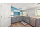 Gray kitchen cabinets and granite countertops at 10913 N 153Rd Ln, Surprise, AZ 85379