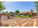 Large grassy yard with mature trees and stone pathway at 10913 N 153Rd Ln, Surprise, AZ 85379