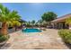 Expansive patio area surrounding a sparkling blue pool at 10913 N 153Rd Ln, Surprise, AZ 85379