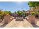 Built-in fire pit with seating area, perfect for outdoor gatherings at 10913 N 153Rd Ln, Surprise, AZ 85379