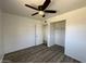 Well-lit bedroom featuring a large closet and ceiling fan at 4908 W Ocotillo Rd, Glendale, AZ 85301